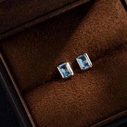 Blue Topaz Stud Earrings 14K Yellow Gold Emerald Cut